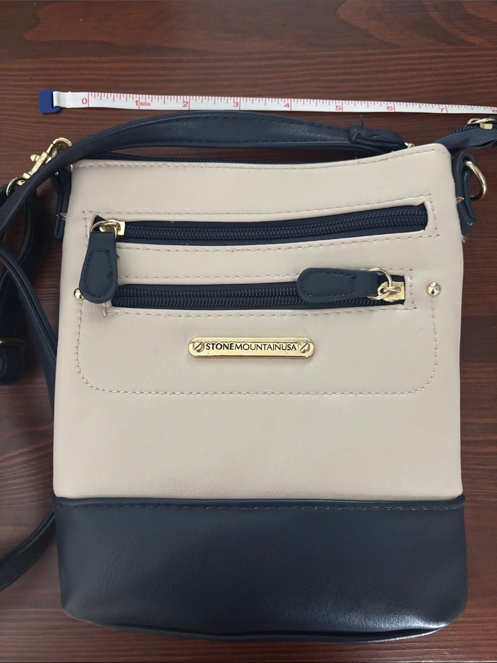 Stone Mountain Accessories Beige and Black Leather Crossbody with Gold Accents